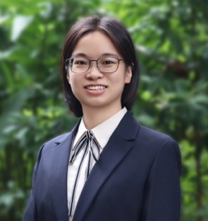 A person in a suit Description automatically generated