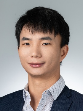 A person in a suit
Description automatically generated