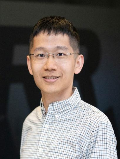 A person wearing glasses and a plaid shirt

Description automatically generated